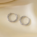 Silver stainless steel hoop earrings featuring unique hammered texture with latch back closure - Hammered Style / Steel