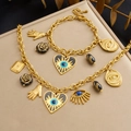 Golden stainless steel jewelry set with evil eye pendants and blue enamel details - B2079+N4139 2-Piece Set