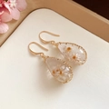Elegant handmade teardrop earrings featuring dried flowers and delicate gold wire wrap - Gold White Teardrop Hook