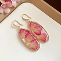 Elegant gold oval earrings with real pink flower petals in resin - Gold Oval Pink Hook