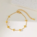 Golden titanium steel chain necklace with hollow flower and cube charms for women - Gold Bracelet (QYE92)