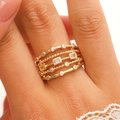 Detailed close-up view of a multi-layer gold geometric ring featuring sparkling zircon inlays. - Multilayer Hollow Braided Style (K-1351) / Medium KC Gold (K-1351)