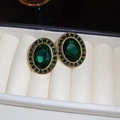 Detailed close-up of vintage oval emerald green crystal earrings in gold halo setting - Green Rhinestone Oval (9#)