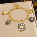 Vergoldetes Gliederkettchen mit Herz-, Teufelsaugen- und Palmenanhängern im Vintage-Stil - Armband / B2077
