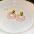 Detailed macro view of elegant pink textured circular stud earrings with gold accents - 62# Steel Pin - Pink Drip Oil Circle (Eco-Friendly)
