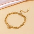 Bracelet à billes dorées poli avec pendentif coeur et fermoir mousqueton ajustable - Cœur à Perles Dorées (E2043) / Or