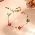 Close-up of a colorful beaded flower bracelet with gold stainless steel chain - Colorful Transparent Flower Bead Bracelet