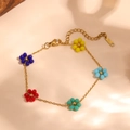 Close-up of colorful beaded flower charms on a delicate gold stainless steel bracelet chain. - Colorful Solid Flower Bead Bracelet