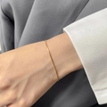 Elegant gold-tone slim snake chain bracelet for women in a minimalist luxury style - 1.2 Round Snake Chain Bracelet (Gold)