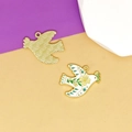 Detailed view of white enamel peace dove charm with floral pattern and gold-tone back - Yellow Flower Peace Dove
