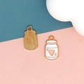 Detailed view of enamel pudding jar charms with pink heart for DIY jewelry making. - 3 Heart Yogurt