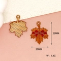 Detailed view of enamel maple leaf charm showing front and back with size dimensions - Maple Leaf / Orange