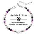 Macro view showing the heart charm and colorful 6mm beads of the protection bracelet - Anxiety Relief Style