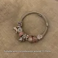 Silver beaded bracelet with pink dolphin and heart charms on a textured fabric base - Exquisite Beaded Style (B1080)