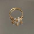 Golden cable bracelet featuring heart, crystal, and crown charms on a reflective surface - Exquisite Beaded Style (B1089—4)