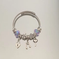 Silver twisted wire bracelet with iridescent purple beads and musical heart charms - Exquisite Beaded Style (B1067-2)