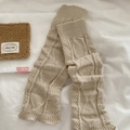 Chic cable-knit leg warmers in beige for women with a cozy winter lifestyle aesthetic - Beige