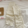 White cable knit leg warmers in Y2K style with soft honeycomb texture and cozy design - Cream