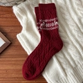 Winter red wool socks featuring Nordic Fair Isle reindeer and snowflake patterns - Plaid Reindeer