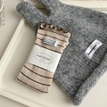 Japanese style beige socks with brown stripes and ruffled cuffs in a tray - Oatmeal