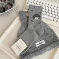Chic grey mid-calf socks with cute poodle motifs and bow details on white tray - One Size / Light Gray