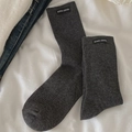 Dark gray ribbed crew socks with minimalist woven tag on white fabric background - Dark Gray