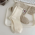Calze da donna in maglia a coste color bianco crema con una trama morbida e accogliente - Taglia unica / Beige