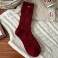 Deep red wool knit mid-calf socks with gold metal accents for winter warmth - Rolled Edge With Gold Tag Style