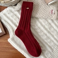 Dark red wool winter socks with ribbed knit pattern and gold metallic logo detail - Wide Ribbed With Gold Tag Style