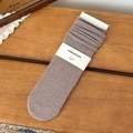 Dusty purple knitted slouch socks with minimalist paper branding on wood background - One Size / Bean Paste Brown