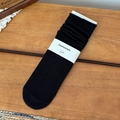 Classic black mid-tube cotton knit socks with vintage rolled edges and paper branding - One Size / Black