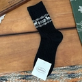 Calze retrò in lana nera con motivi a maglia di renne e fiocchi di neve bianchi - Nero