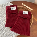 Burgundy ribbed knit leg warmers with folded cuffs and a white cloth label detail - One Size / Red
