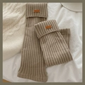Jambières tricotées en beige kaki avec écusson en cuir vintage et texture côtelée - Taille unique / Khaki
