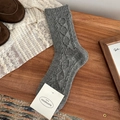 Dark grey knit wool socks with classic cable pattern in a vintage winter setting - One Size / Light Gray