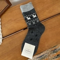Fair Isle dark grey wool socks with white puppy patterns on rustic wooden bench - One Size / Dark Gray