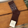 Deep brown winter socks with blue snowflake patterns and embroidered vintage details - Snowflake