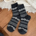 Thick dark grey wool socks featuring white Nordic snowflake and geometric stripe patterns - One Size / Dark Gray