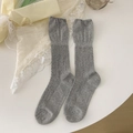 Light gray cable knit crew socks with delicate ruffled edges for a vintage look - Light Gray