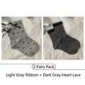 Set of 2 gray cotton crew socks with heart patterns, ribbon bows, and lace trim details - 2 Pairs: Light Grey Ribbon & Dark Grey Heart Lace (2515花边爱心系)