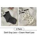 Set of 2 women's crew socks in dark grey and cream with lace trim and heart patterns - 2 Pairs: Dark Gray Lace + Cream Heart Lace (2515 Lace Heart Series)