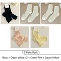 Five-pack set of mesh cutout crew socks with lace edges and small bow embroidery details - One Size / 5 Pairs (Black + Milk White x2 + Milk Pink + Milk Yellow)
