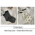 Set of 2 cotton mid-tube socks in dark grey and cream with lace trim and bow accents - 2 Pairs: Dark Grey Lace + Cream Butterfly Lace (2515 Lace Heart Series)
