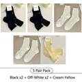 5-pack mesh hollow-out socks with heart patterns and ruffled edges in mixed colors - One Size / 5 Pairs (Black x2 + Milk White x2 + Milk Yellow)