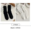 Dos pares de calcetines de canalé estilo japonés con lazos en negro y blanco roto - 2 Pares - Negro + Blanco