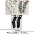 Three-pack of ribbed JK socks with ribbon bows in white, light gray, and dark gray tones - 3 Pairs - White + Light Gray + Dark Gray
