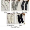 Three-pack ribbed knit crew socks with bow detail in white, grey, and black tones - 3 Pairs - Custom (Random)