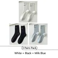 Three-pack mid-calf crew socks in white, black, and blue with letter embroidery - 3 Pairs - White + Black + Milk Blue