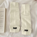 Chic cream white knitted leg warmers with ribbed texture and black logo label - One Size / Cream