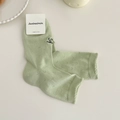Light green combed cotton socks with hollow knit mesh and black bow embroidery detail - Milky Green